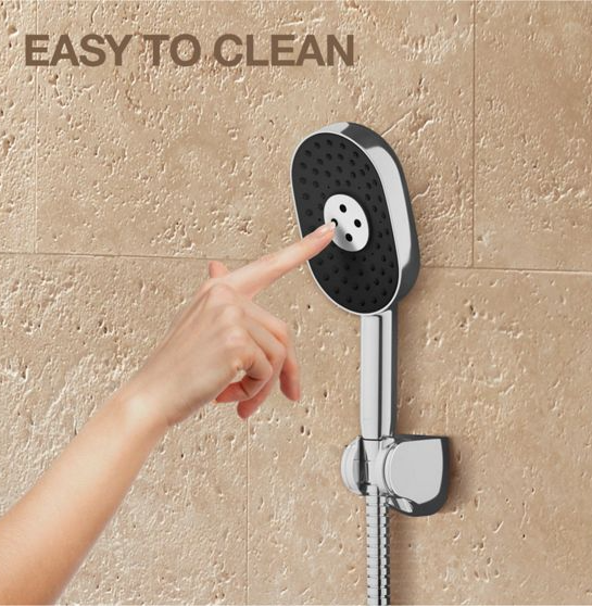 Hand pressing a shower head with 'Easy to Clean' text on a beige tiled wall.