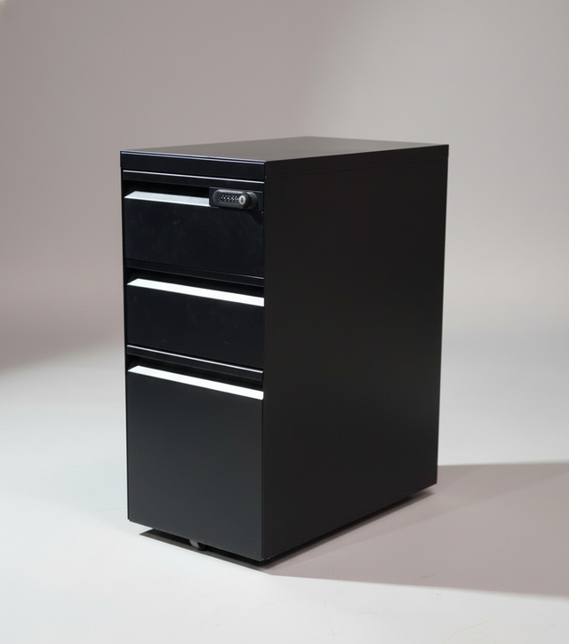 Black metal file cabinet against a dark gray wall.