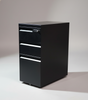 Black metal file cabinet against a dark gray wall.
