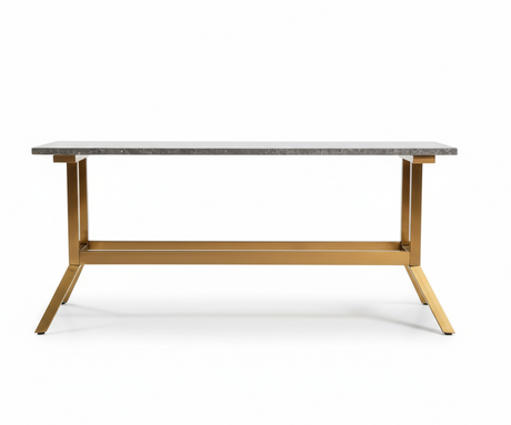 Table with a metallic frame and stone-like top on a dark background