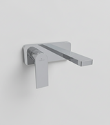 Chrome wall-mounted faucet on a white background