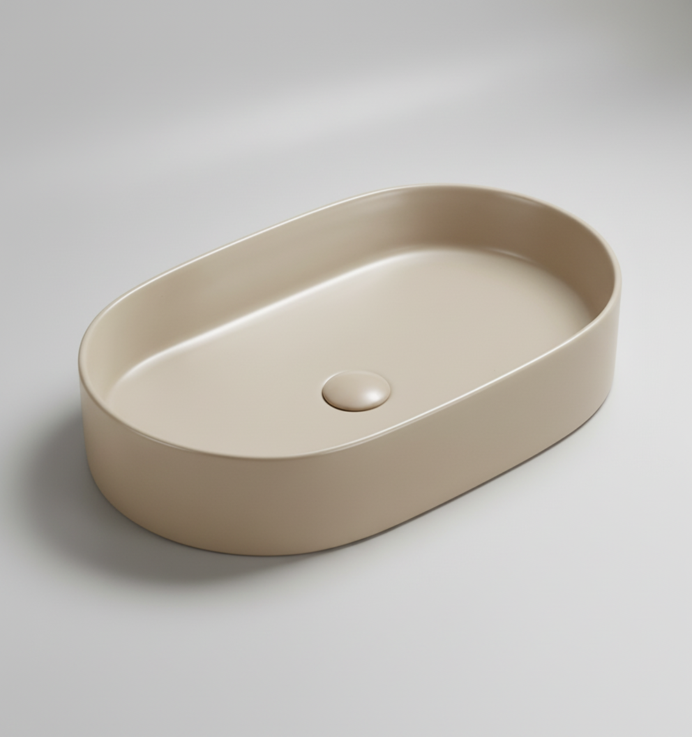 Beige oval ceramic sink on a white background