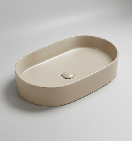 Beige oval ceramic sink on a white background