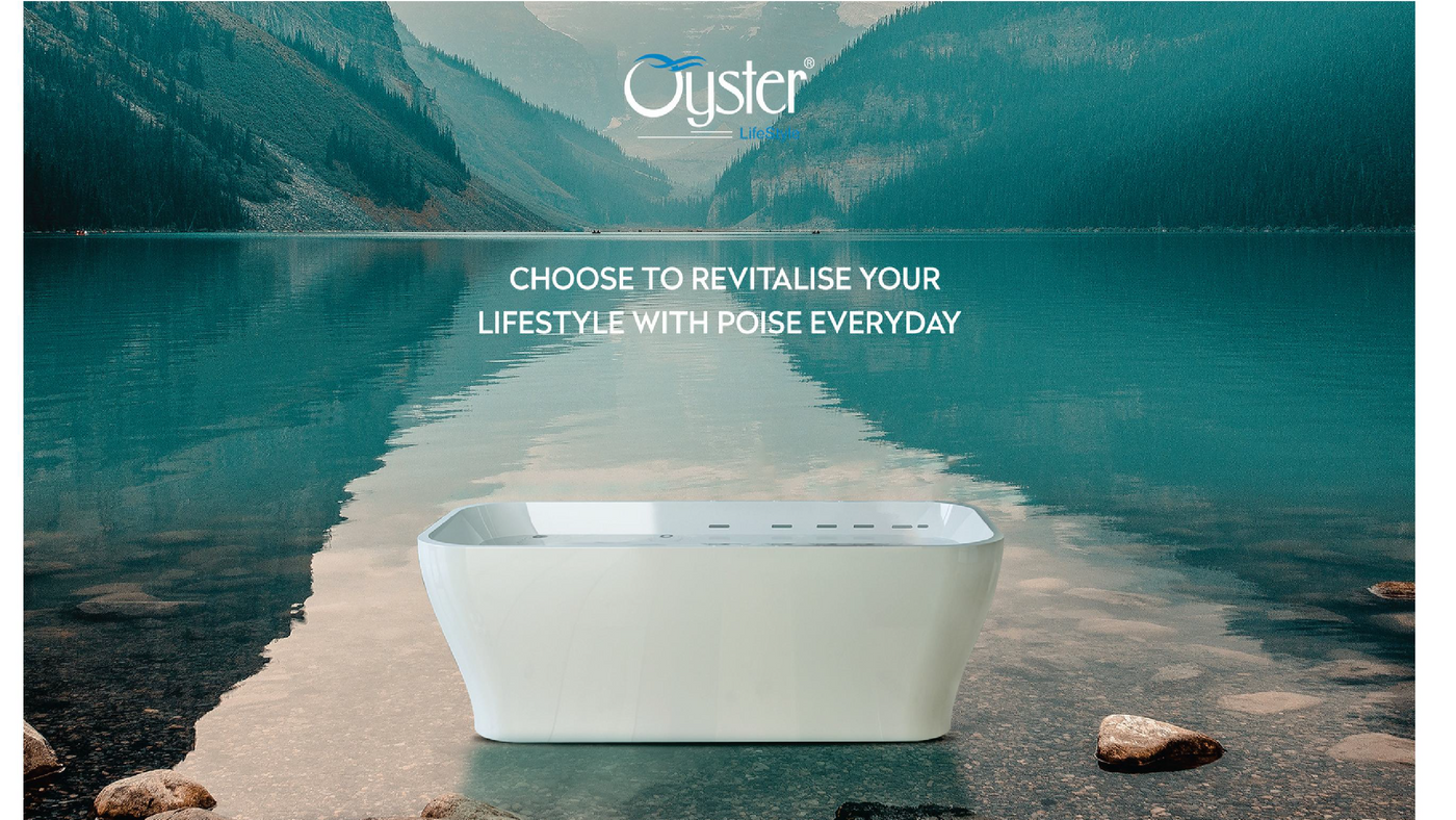 White bathtub in front of a scenic lake with mountains, featuring the Oyster brand.